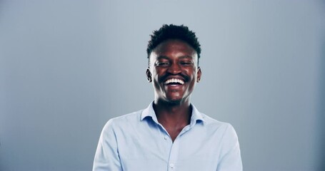 Face, man and laugh in studio with happy expression, silly joke and humor on grey background. Portrait, african model and cheerful for comedy, crazy news or funny reaction to meme, emoji or good mood