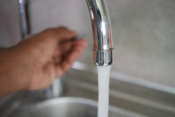 water pouring from a faucet tap slow motion 