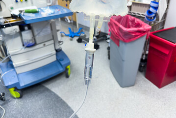 intravenous drug drip hangs, symbolizing medical care, treatment, and the monitoring of a patient's condition