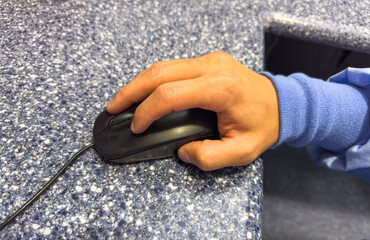 electronic mouse on a desk, sleek design and buttons, symbolizing modern computing, precision, and...