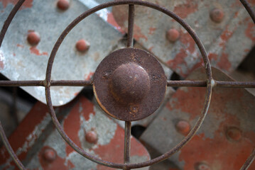 Old rusty fan close-up. Industrial background. Selective focus.