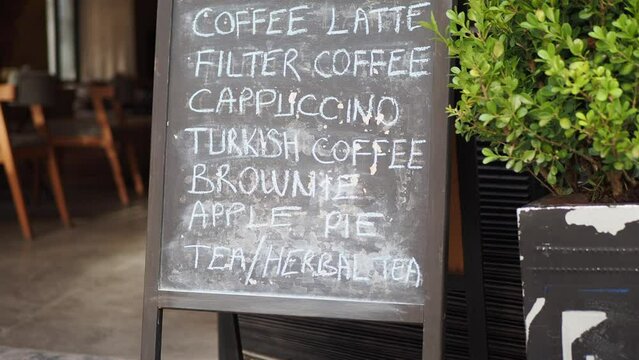 Cafe menu on black board outdoor 