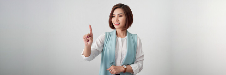 Businesswoman pressing button or something with copy space for your design. Panorama