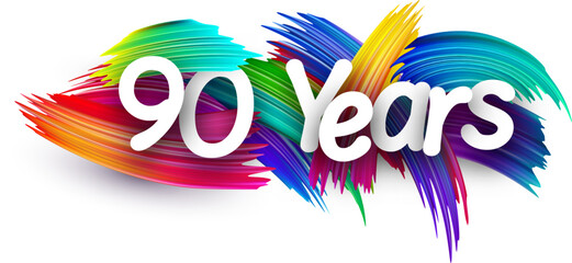 Obraz premium 90 years paper word sign with colorful spectrum paint brush strokes over white.