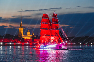 Scarlet sails ship on Neva river on Neva river on alumni celebration. Saint-Petersburg, Russia