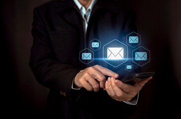 Technology concept. Close up of businessman working on lsmart phone , sending email from smartphone for his business ,marketing,digital message,electronic mail.