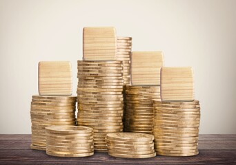 the number 2024 on wooden cubes with coins.