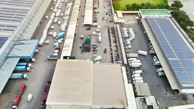 Organized Chaos: The aerial view captures the controlled chaos of a distribution center, where countless packages are sorted and dispatched in a symphony of movement.
