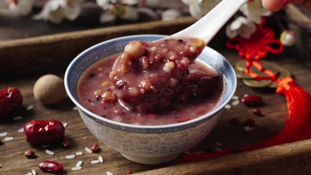 traditional food  rice porridge or Laba porridge on wooden table.