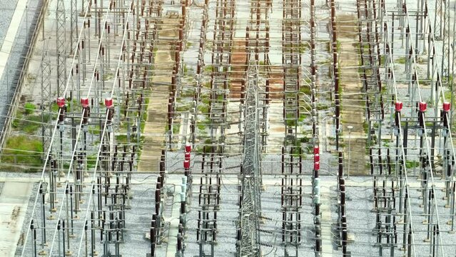 From above, the high voltage power station is a testament to human ingenuity, a symphony of metal and machinery, where energy flows like a modern marvel, pulsating through the grid.
