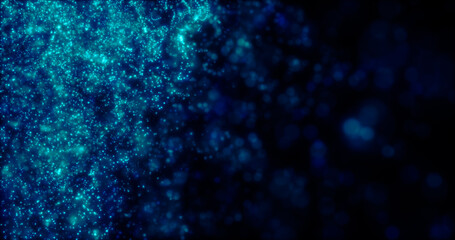 Blurred blue abstract background of bokeh and small round particles of energy magical holiday flying dots on a black background