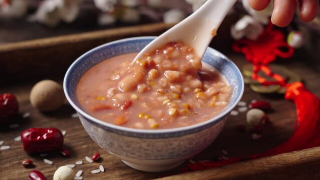 traditional food  rice porridge or Laba porridge on wooden table.