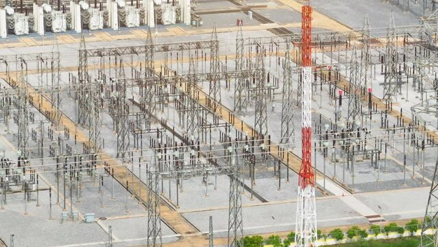 A high voltage power station is an electrical substation equipped with transformers and switchgear to convert and transmit electricity at voltages exceeding 100 kV. Aerial view.
