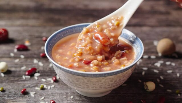traditional food  rice porridge or Laba porridge on wooden table.