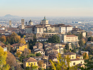 Fototapeta na wymiar Bergamo. One of the beautiful city in Italy. Morning landscape at the old town from Saint Vigilio hill during fall season