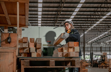 Woodworkers operate machines, tend lathes to cut, shape wood fixtures in manufacturing process