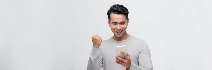Fototapeta premium smiling male client use cellular read great news
