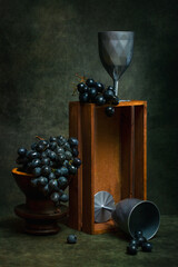 Still life with grapes, a box and glasses