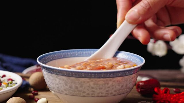 traditional food  rice porridge or Laba porridge on wooden table.