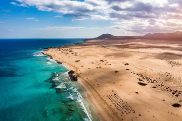 Papier Peint photo autocollant Atlantic Ocean Road Aerial view of beach in Corralejo Park, Fuerteventura, Canary Islands. Corralejo Beach (Grandes Playas de Corralejo) on Fuerteventura, Canary Islands, Spain. Beautiful turquoise water and white sand.
