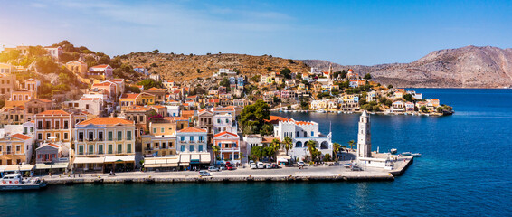 Aerial view of the beautiful greek island of Symi (Simi) with colourful houses and small boats....