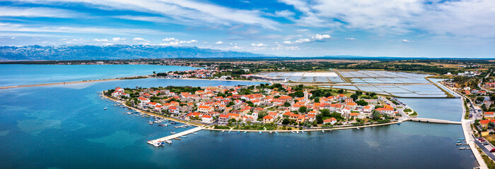 Historic town of Nin laguna aerial view with Velebit mountain background, Dalmatia region of Croatia. Aerial view of the famous Nin lagoon and medieval in Croatia - 684938275
