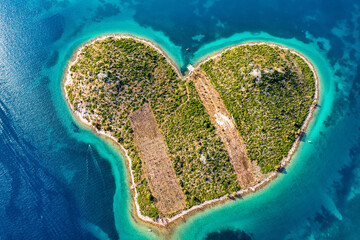 Aerial view of the heart shaped Galesnjak island on the adriatic coast, Zadar, Croatia. Heart shaped island of Galesnjak in Zadar archipelago aerial view, Dalmatia region of Croatia. - obrazy, fototapety, plakaty