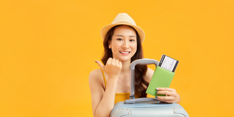 Happy Asian tourist woman holding passport and boarding pass with baggage going to travel