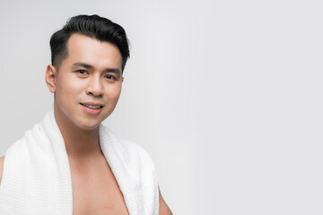 Portrait of a smile asian man with towel on shoulders looking at camera - 684939622