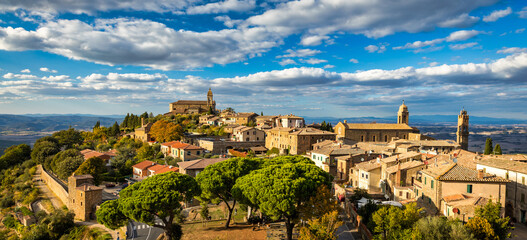 Fototapeta na wymiar View of Montalcino town, Tuscany, Italy. Montalcino town takes its name from a variety of oak tree that once covered the terrain. View of the medieval Italian town of Montalcino. Tuscany