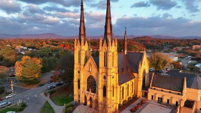Catholic Church during golden hour sunrise. Basilica of St. Andrew in Roanoke, Virginia during autumn.
