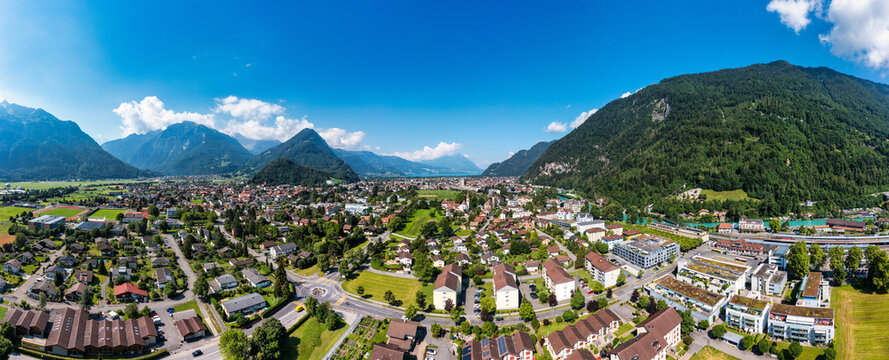 Aerial view over the city of Interlaken in Switzerland. Beautiful view of Interlaken town, Eiger, Monch and Jungfrau mountains and of Lake Thun and Brienz. Interlaken, Bernese Oberland, Switzerland.