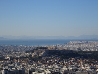 Fototapeta na wymiar リカヴィトスの丘から眺めるパルテノン神殿・アクロポリスの丘　Παρθενώνας, Ακρόπολις　Athens, Greece