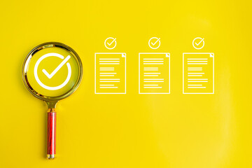Magnifying glass on yellow background. correct or check E-Document inspection. Business industry...