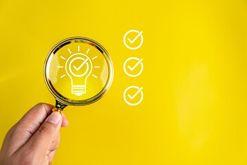 Business creativity and inspiration concepts with lightbulb on yellow background. motivation for success.think big ideas, idea checking icon inside magnifier glass, working creatinity.