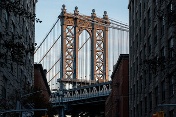 Naklejka premium Pillar of Manhattan Bridge as seen from an alley in Dumbo district in Brooklyn.