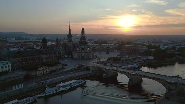 Smooth aerial top view flight 
Sunset city Dresden Church Cathedral Bridge River. panorama orbit drone
4k Landscape footage