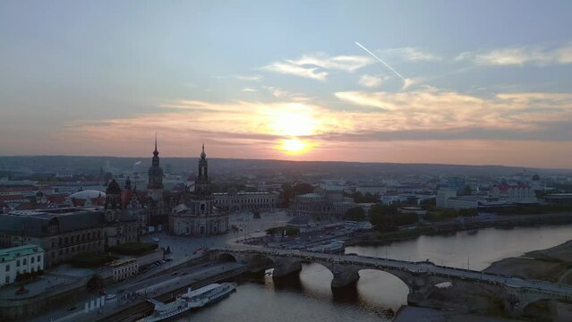Magic aerial top view flight 
Sunset city Dresden Church Cathedral Bridge River. descending drone
4k Landscape footage