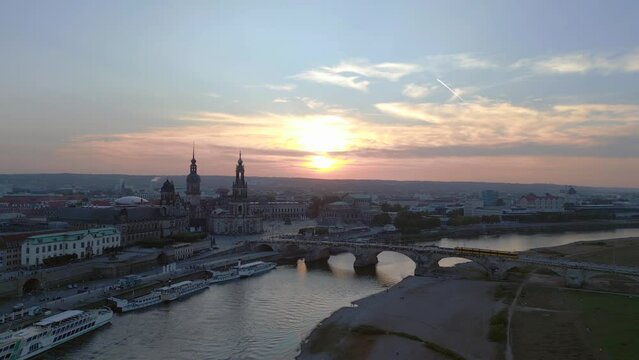 Nice aerial top view flight 
Sunset city Dresden Church Cathedral Bridge River. panorama overview drone
4k Landscape footage