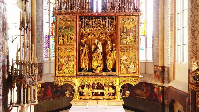 Late Gothic wooden golden altar in the Catholic church with the apostles. The biggest altar. St. James the Apostle altar, created by the workshop of Master Paul. Levoca, Slovakia