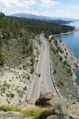 
Vertical view of Highway 50 from the top of Cave Rock on the East Shore of Lake Tahoe on a sunny day with blue skies
