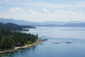 Scenic view of mountains and forested coastline of the East Shore of Lake Tahoe from the top of...