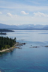 Scenic view of mountains and forested coastline of the East Shore of Lake Tahoe from the top of Cave Rock, Nevada     