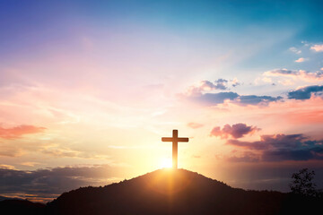 Silhouette wooden cross on mountain sunset background