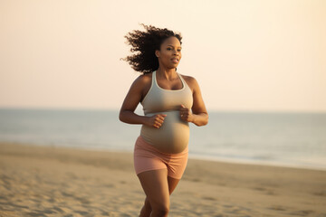 Pregnant afro american woman running on beach