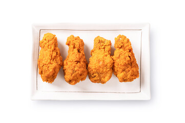  Top view of Fried chickens on square plate isolated on white background.