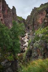 Jily-su tract, Syltran-su mountain waterfall, Elbrus, Caucasus. Thawed mountain waters of the river in summer, a stormy stream