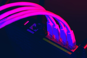 Cables plugged in a Wi-Fi router on dark background