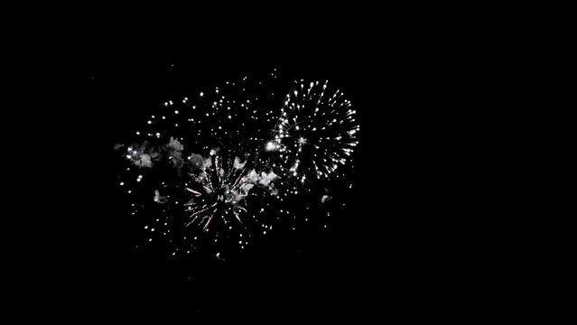 Abstract Colorful Fireworks on black background from international fireworks festival, 4th of July independence day and new year 2024 holiday concept. High quality 4k realtime cinematic raw video