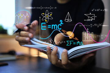 physics and mathematics equation concept with student writing on a notebook about Albert Einstein's calculations of the equations of relativity and Sir Isaac Newton's theory of gravity on note book - obrazy, fototapety, plakaty